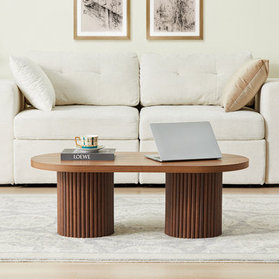 Oval coffee table with fluted column feet