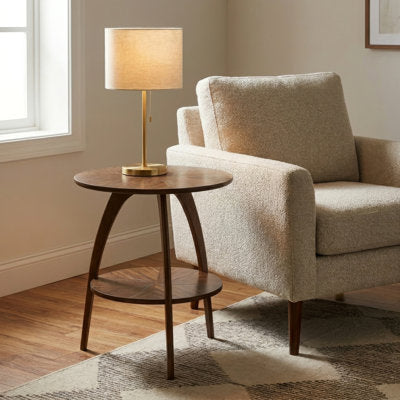 Circular end table with tripod base and lower storage shelf