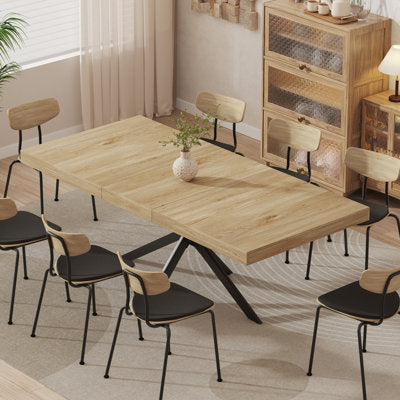 Extendable rectangular dining table with metal legs and storage center panel