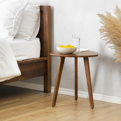Triangular top end table with three tapered solid wood legs