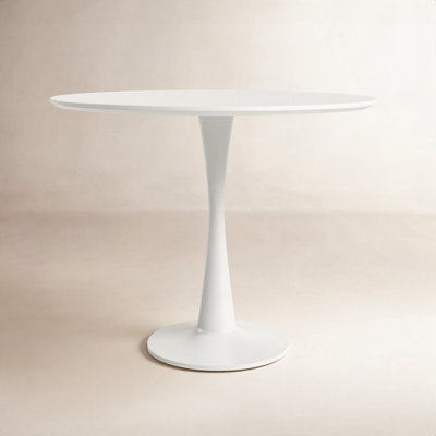 White round pedestal dining table with glossy lacquered finish