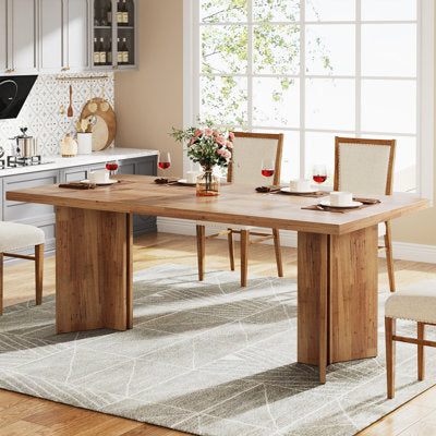 Wide dining table with double pedestal base and rustic wood finish